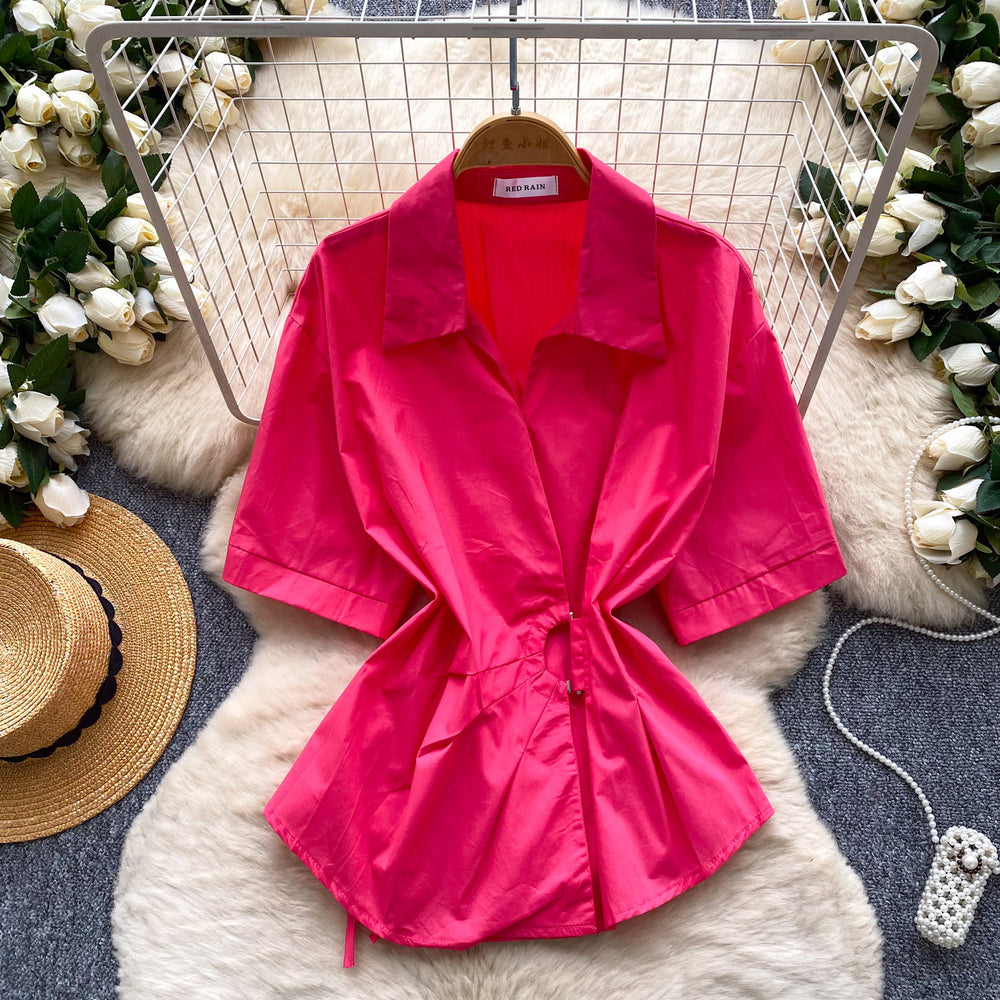 Korean-inspired, design-forward, cinched-waist blouse for women. spring collection, short-sleeved, relaxed-fit, open-front cardigan. elegant and sophisticated, with a touch of french flair