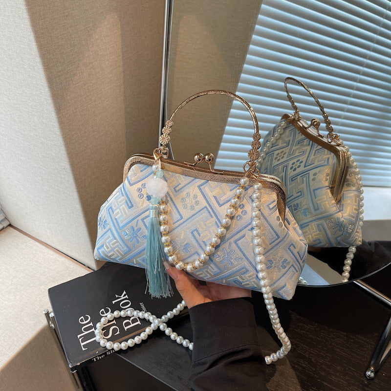 Cross-border new Chinese style national style hand bag women's summer 2025 new niche messenger bag Korean version popular mouth gold bag