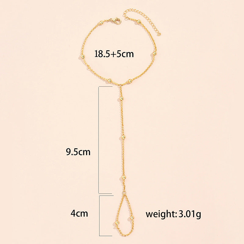 European and american new arrival versatile jewelry: minimalist white pearl bracelet, women's butterfly finger chain bracelet - wholesale from manufacturer