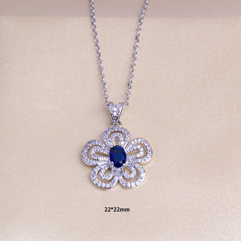 Women's jewelry set: sea blue gemstone flower necklace, earrings, and ring set - minimalist, stylish, and luxurious titanium steel pendant
