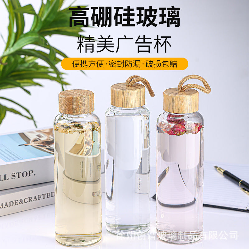 Cross-border 16oz bamboo cover with lifting rope heat-resistant silicone sleeve transparent single-layer borosilicate glass water cup printing logo