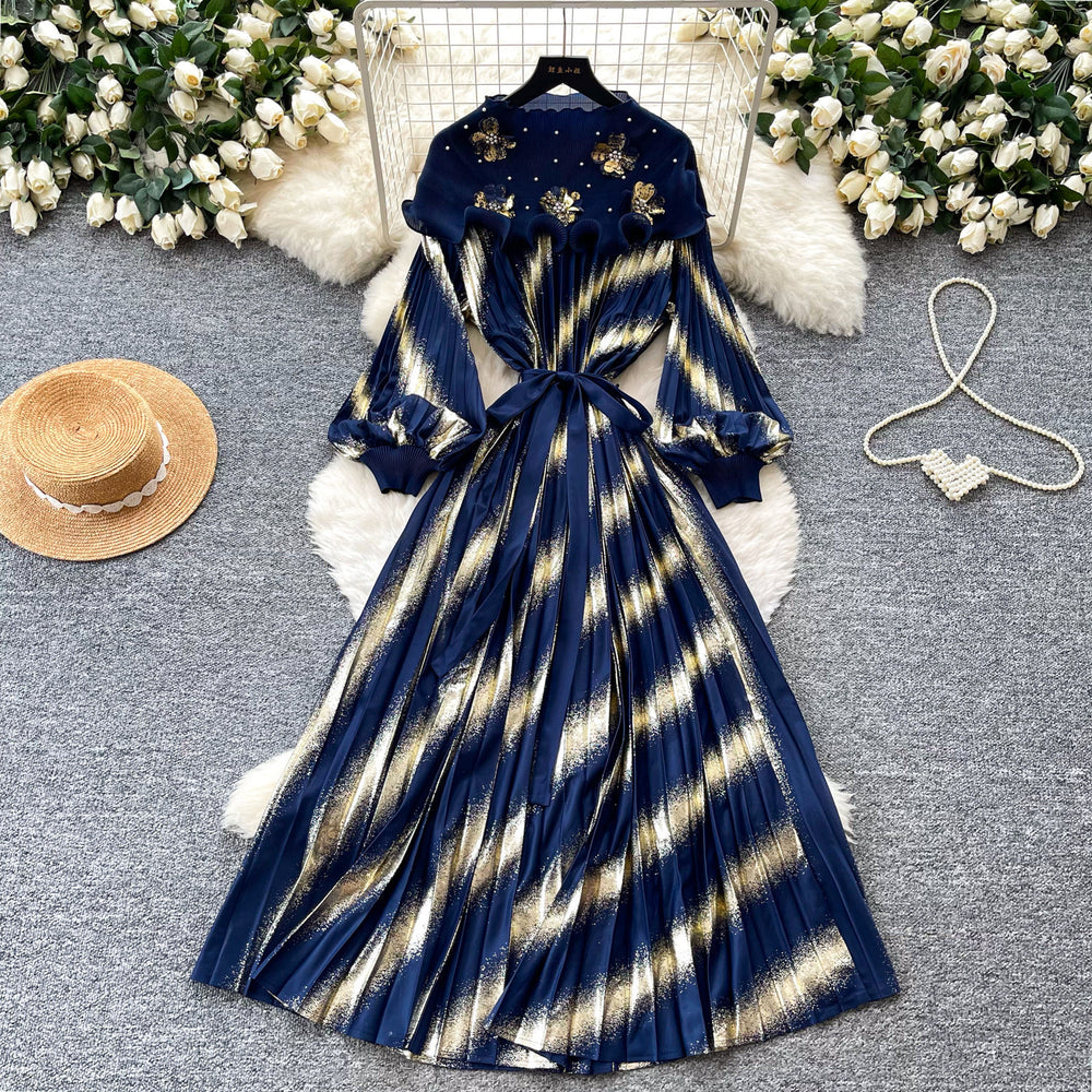 Heavy-duty beaded and gold-stamped lantern sleeve a-line dress for women, perfect for spring. features a cinched waist for a slimming effect, elegant and subtly luxurious design, and a full, flowing skirt