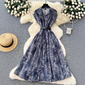 French chic, sophisticated, and unique: tie-waist, short-sleeve, single-breasted, fashionable printed pleated shirt dress with a touch of class