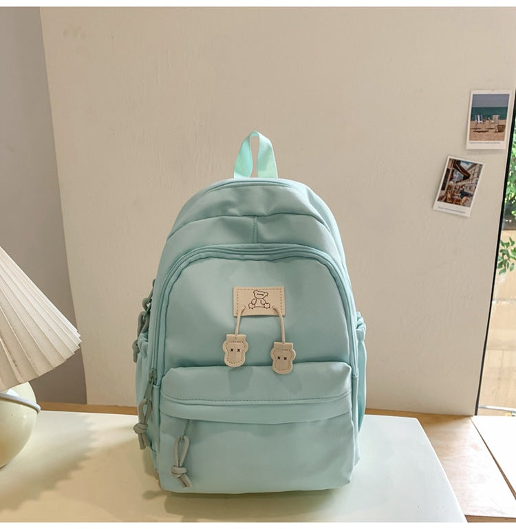 School bag female college student Korean version ins solid color simple and versatile junior high school student travel small backpack high school student backpack