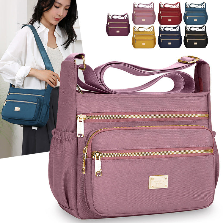 Women's bags are fashionable and simple, large-capacity messenger bags, multi-layer storage, travel shoulder bags, going out for commuting, middle-aged mother bags.