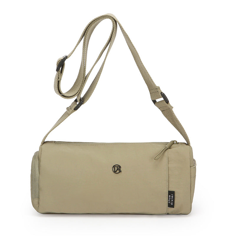 Simple Japanese shoulder bag women's nylon anti-splashing cylinder pillow bag trendy cool messenger bag commuter portable handbag