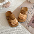 Cute and cuddly birkenstock-inspired slippers for kids, perfect for spring and autumn wear. these closed-toe, half-slippers feature a soft, comfortable sole and a slip-on design, making them ideal for lazy days