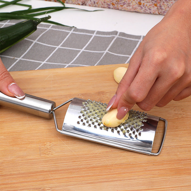 Stainless steel multi-purpose vegetable peeler & slicer - shreds potatoes, onions, radishes, and cucumbers - kitchen gadget