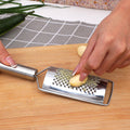 Stainless steel multi-purpose vegetable peeler & slicer - shreds potatoes, onions, radishes, and cucumbers - kitchen gadget