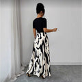 women's v-neck a-line dress with cinched waist, black and white abstract print, and metal buckle detail – elegant and versatile