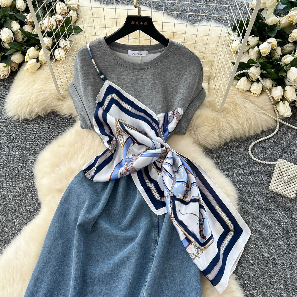 French-inspired, niche design, patchwork, tie-waist, short-sleeve denim dress for women. slimming, elegant, and features a slit midi length