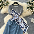 French-inspired, niche design, patchwork, tie-waist, short-sleeve denim dress for women. slimming, elegant, and features a slit midi length