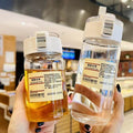 Muji-inspired plastic water bottle, stylish and minimalist design for students, travel-friendly with tea infuser and handle, perfect for outdoor use