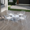 Four chairs and a table white