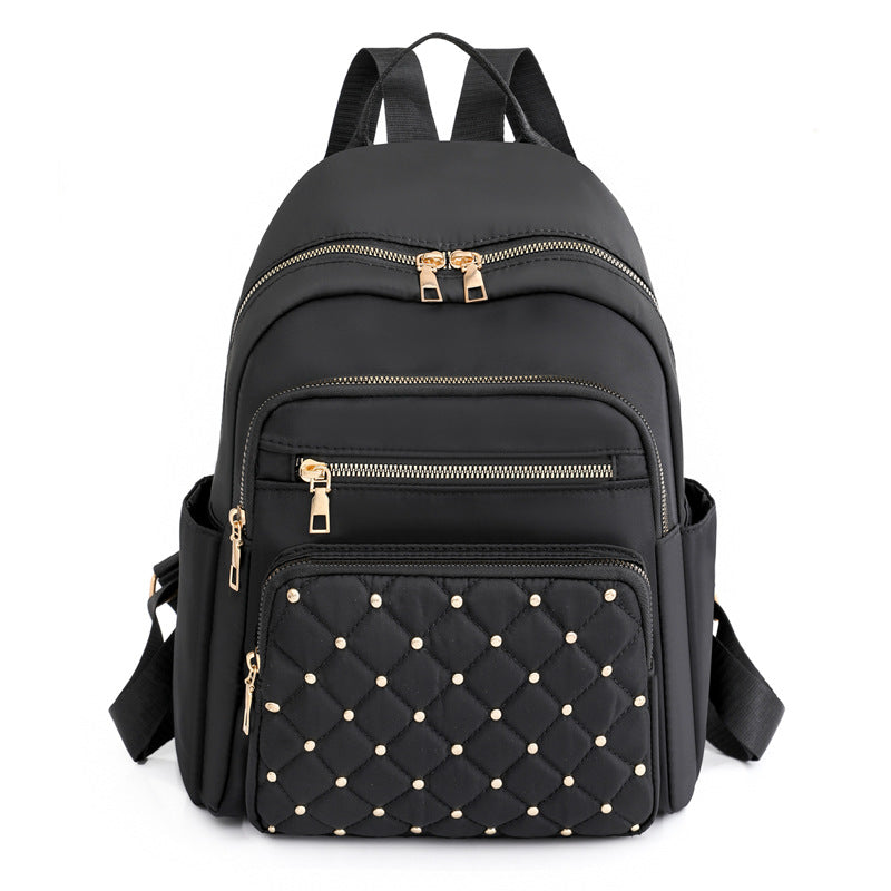 Solid color rhombus sewing line rivets fashion backpack women's 2025 texture Korean version large capacity simple women's backpack