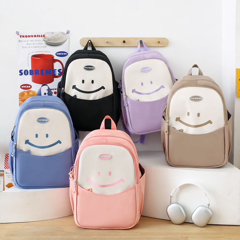 Cute smiley face, primary and secondary school student schoolbag, simple and fashionable, large-capacity backpack, small and fresh, going out travel backpack.